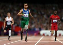 A picture of a men running on the track