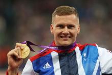 A picture of a man with a medal around his neck