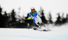 A picture of a woman skiing on the slopes