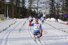 A picture of a man celebrating after crosses the finish line