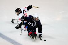 A picture of the ice sledge hockey player on the field