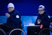 A picture of a man and a woman in wheelchairs