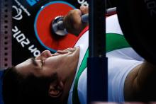 A picture of a powerlifter on a bench competing