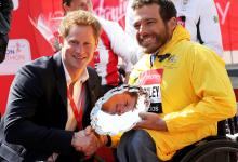 Prince Harry presents Kurt Fearnley with his 2013 Virgin London Marathon trophy