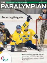 Cover photo of the magazine Paralympian showing ice sledge hockey players from Sweden and Germany with the text: Perfecting the game.