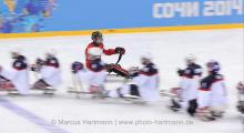 CAN vs USA Players touch gloves after a USA win against Canada 3-0