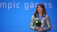 Amy Purdy, USA, at the victory ceremony of the women's snowboard cross standing at the Sochi 2014 Paralympic Winter Games.