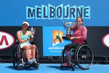 The Netherlands' Jiske Griffioen poses her with her trophy after winning her women's wheelchair singles final against Japan's Yui Kamiji at the Australian Open 2015 Wheelchair Championships. 