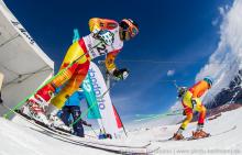 Two skiers starting from a start house on a ski slope