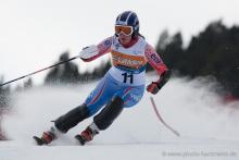 A picture of a woman skiing on the slopes