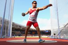 Dan Greaves of England competes in the Men's F42/44 Discus final at Hampden Park Stadium at the Glasgow 2014 Commonwealth Games.