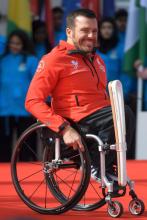 Wheelchair Racer and Paralympian Kurt Fearnley of Australia with the baton during the launch of The Queen's Baton Relay for the XXI Commonwealth Games being held on the Gold Coast in 2018 at Buckingham Palace.