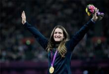 A picture of a woman celebrating her gold medal