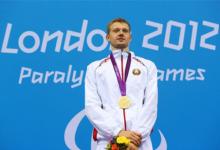 A picture of a man with a gold medal around his neck