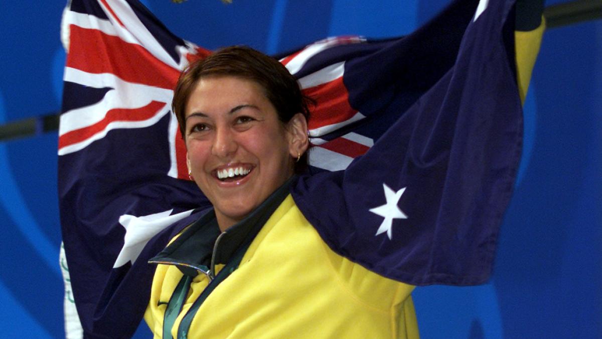 An Australian swimmer celebrates winning a gold medal at the Sydney 2000 Paralympic Games.