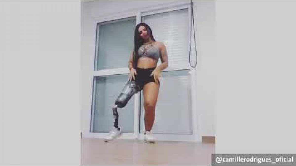 a female Para swimmer with a prosthetic leg dancing to samba music