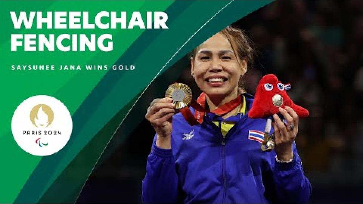 Video Thumbnail of Saysunee Jana holding her gold medal with text &quot;Wheelchair fencing Paris 2024&quot;.
